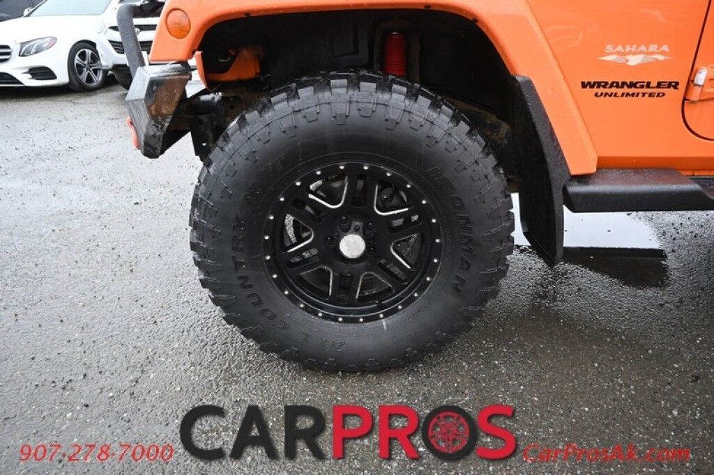 2012 Jeep Wrangler Unlimited Sahara - 4x4 - Remote Start - 3.6L V6 - Leather & Heated Seats - Power WIndows & Locks - Keyless Entry - Infinty Sound System - NAV - Bluetooth - Winch Ready Bumper w/ 20 Lightbar - Color Matched Hard Top - American Outlaw Wheels - Tow Pkg Anchorage AK