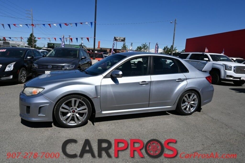 2012 Subaru Impreza Sedan WRX STI - AWD - 6-Speed Manual - STI Short Throw Shifter - Front Heated Alcantara Bucket Seats - Pioneer Radio - Keyless Entry - 18' STI Wheels - Painted Spoiler - Air Conditioning