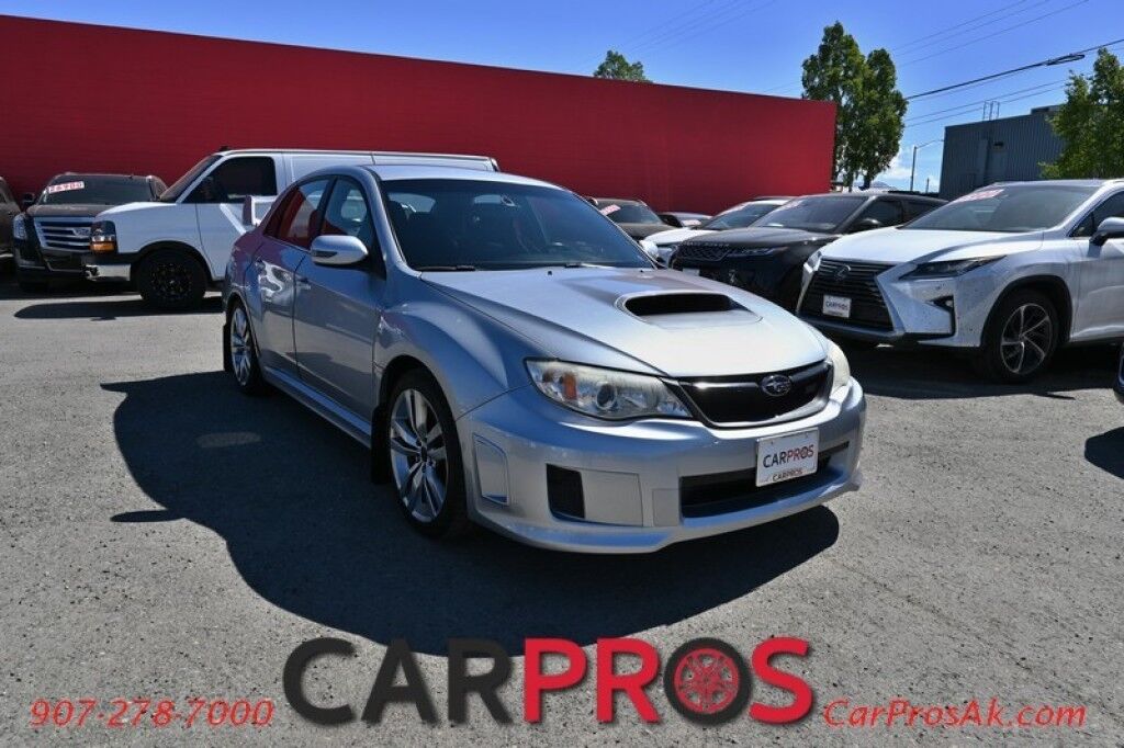 2012 Subaru Impreza Sedan WRX STI - AWD - 6-Speed Manual - STI Short Throw Shifter - Front Heated Alcantara Bucket Seats - Pioneer Radio - Keyless Entry - 18' STI Wheels - Painted Spoiler - Air Conditioning