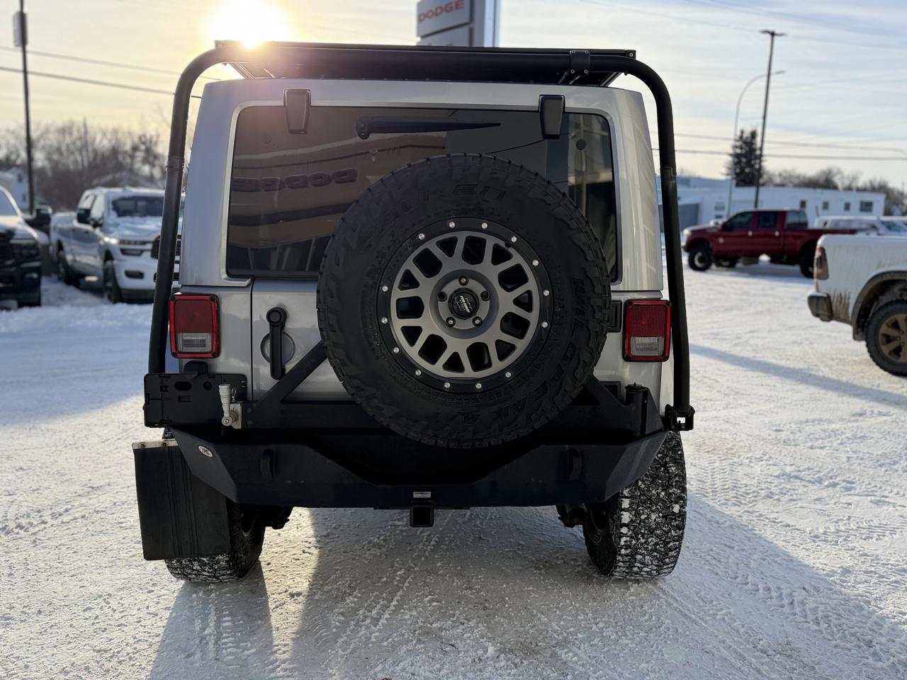 2014 Jeep Wrangler Unlimited Sahara | 2.5" Lift | Upgraded Bumpers | Rim & Tire Pkg | Overland Rack | One Owner Redwater AB