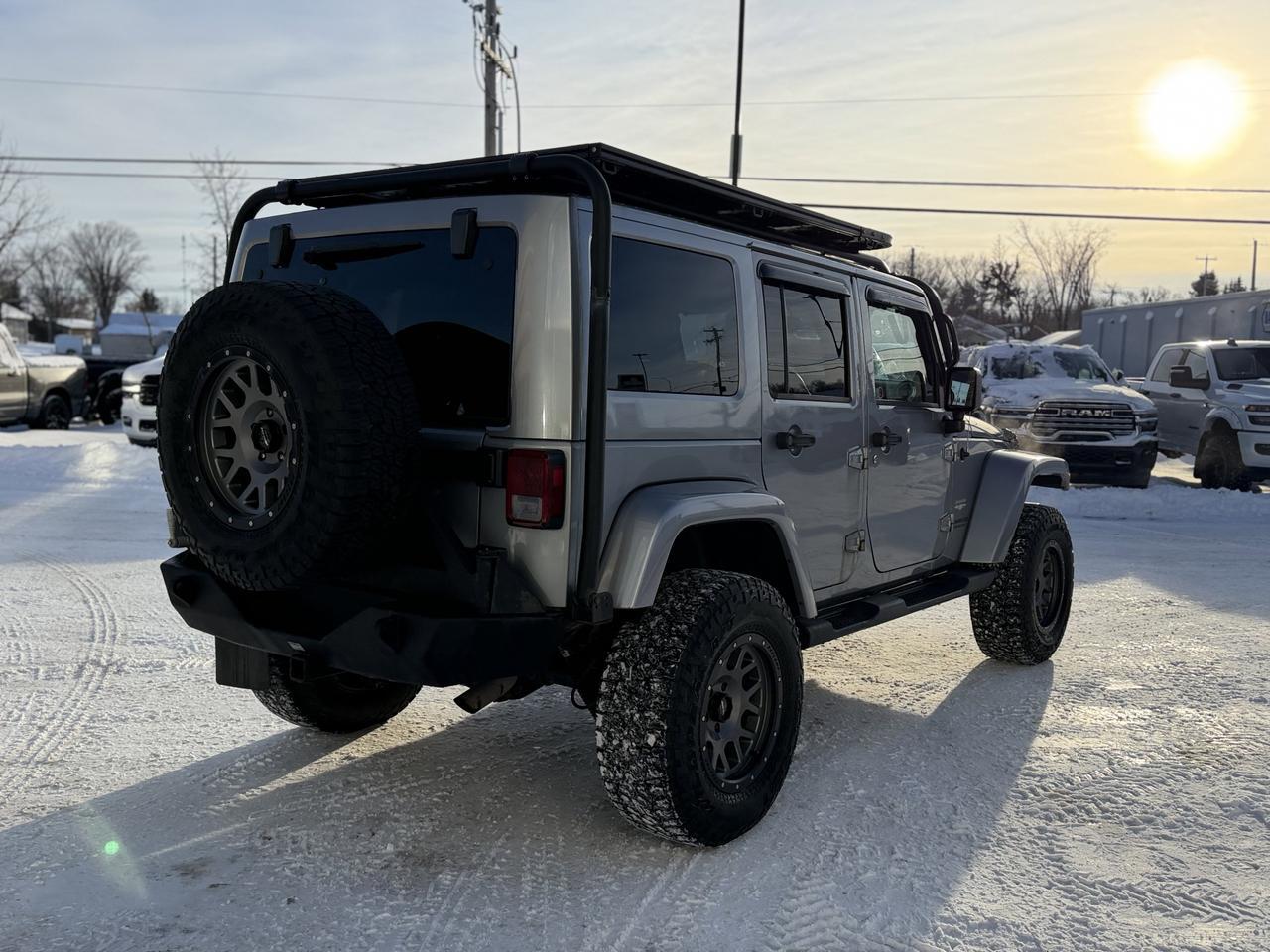 2014 Jeep Wrangler Unlimited Sahara | 2.5" Lift | Upgraded Bumpers | Rim & Tire Pkg | Overland Rack | One Owner Redwater AB