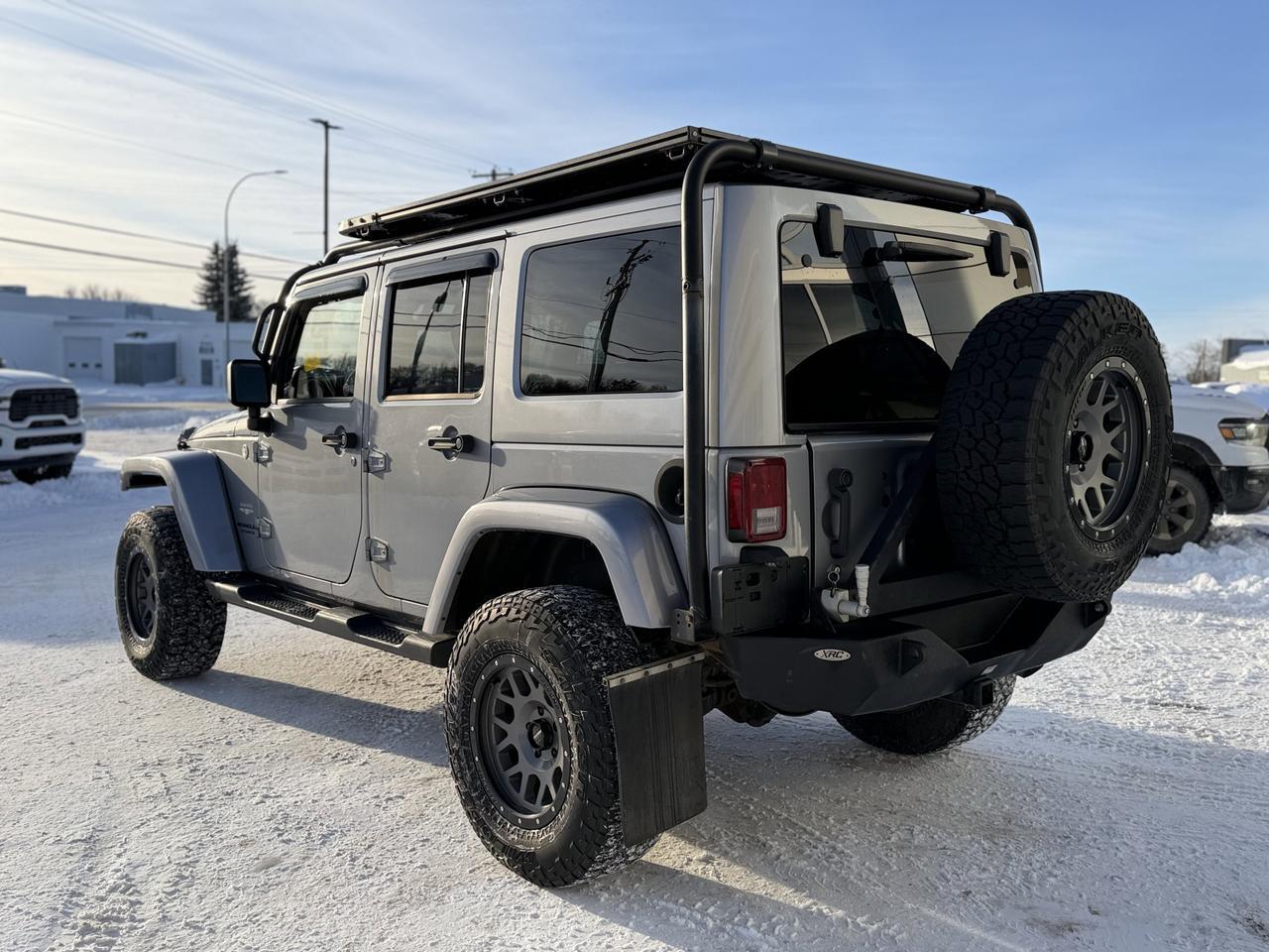 2014 Jeep Wrangler Unlimited Sahara | 2.5" Lift | Upgraded Bumpers | Rim & Tire Pkg | Overland Rack | One Owner Redwater AB