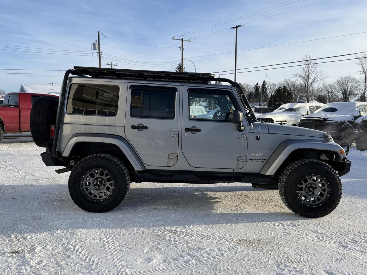2014 Jeep Wrangler Unlimited Sahara | 2.5" Lift | Upgraded Bumpers | Rim & Tire Pkg | Overland Rack | One Owner Redwater AB