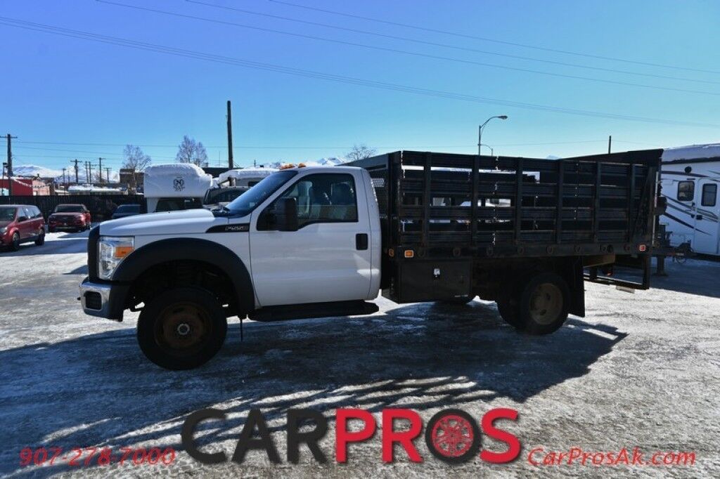 2015 Ford Super Duty F-550 XL - 6.8L V10 - 4X4 - Dually - Single Cab - 152 Stake bed w/ Waltco Power Lift System - Roughneck Storage Boxes - Tow Mirrors - Cruise Control - Air Conditioner - AUX - 1 Owner - Low Miles