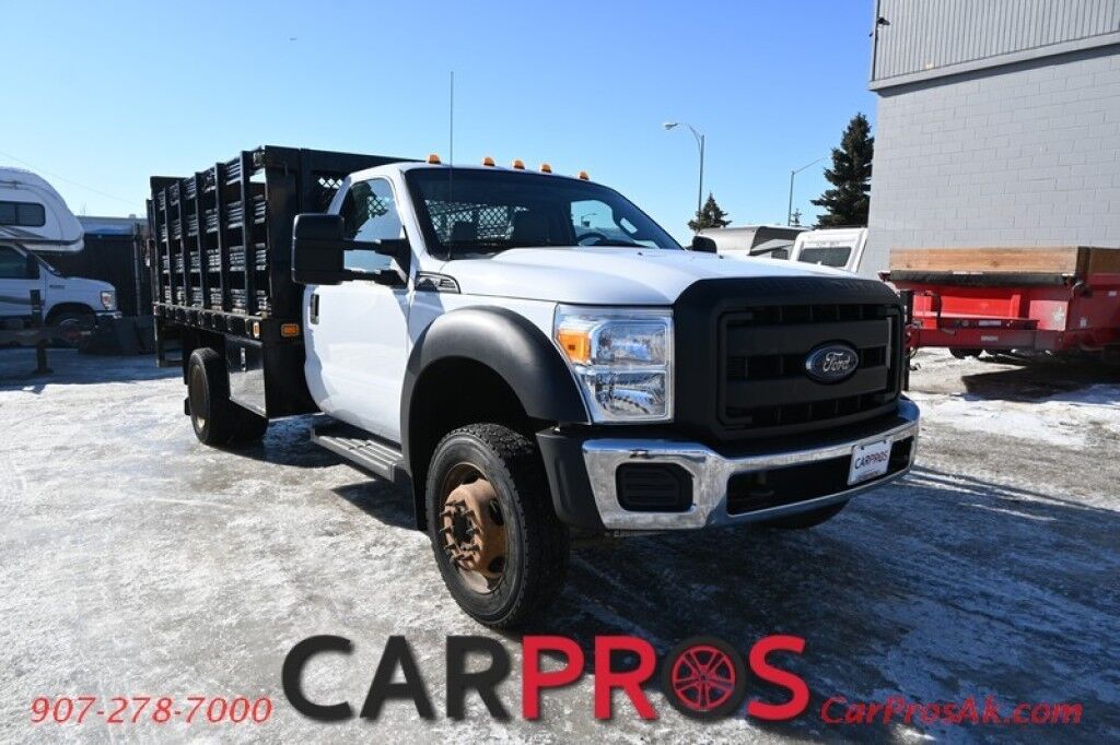 2015 Ford Super Duty F-550 XL - 6.8L V10 - 4X4 - Dually - Single Cab - 152 Stake bed w/ Waltco Power Lift System - Roughneck Storage Boxes - Tow Mirrors - Cruise Control - Air Conditioner - AUX - 1 Owner - Low Miles