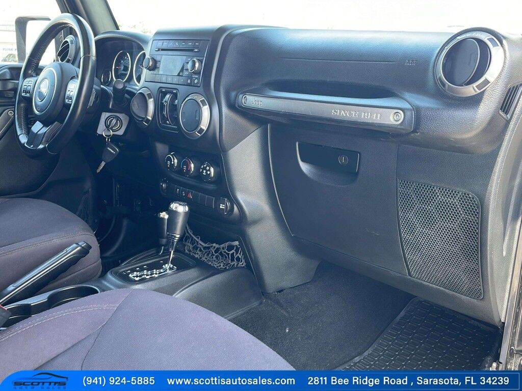 2015 Jeep Wrangler Unlimited Freedom Edition~4X4~ANTI-THEFT SYSTEM~CRASH SENSORS~CRUISE CONTRO;~LIMITED SLIP DIFFERENTIAL~PREMIUM SOUND SYSTEM~REMOVABLE ROOF~RUNNING BOARDS~TOW HOOKS~TRAILER WIRING Sarasota FL