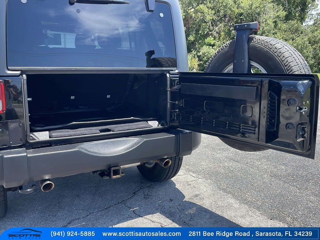 2015 Jeep Wrangler Unlimited Freedom Edition~4X4~ANTI-THEFT SYSTEM~CRASH SENSORS~CRUISE CONTRO;~LIMITED SLIP DIFFERENTIAL~PREMIUM SOUND SYSTEM~REMOVABLE ROOF~RUNNING BOARDS~TOW HOOKS~TRAILER WIRING Sarasota FL
