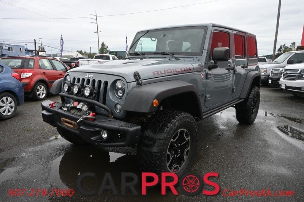 2015 Jeep Wrangler Unlimited Rubicon Hard Rock - 4X4 - 6 Speed Manual - Hard Top - Heated Leather Seats - Power Locks, Windows & Mirrors - Bluetooth - Navigation - Alpine Speakers - Winch - Keyless Entry - Aluminum Wheels Anchorage AK