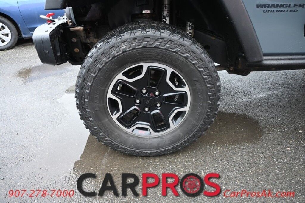 2015 Jeep Wrangler Unlimited Rubicon Hard Rock - 4X4 - 6 Speed Manual - Hard Top - Heated Leather Seats - Power Locks, Windows & Mirrors - Bluetooth - Navigation - Alpine Speakers - Winch - Keyless Entry - Aluminum Wheels Anchorage AK