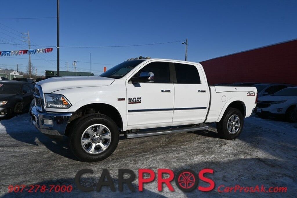2015 Ram 3500 Laramie - 4X4 - 6.4L V8 - Crew Cab - Front Heated & Cooled Leather Seats - Heated Steering Wheel - 2nd Row Heated Seats - Remote Start - Navigation - Sunroof - Bluetooth - Backup Camera - Ram Storage Box - Bedliner - Tow Pkg