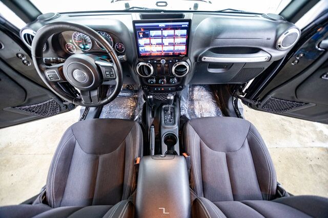 2016 Jeep Wrangler 4x4 Sahara Red Deer AB