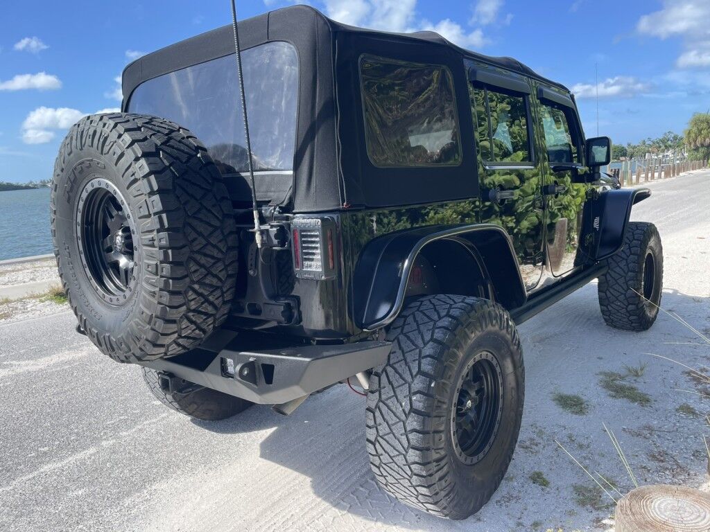 2016 Jeep Wrangler Unlimited Rubicon~LOW MILES~WINCH~LED LIGHTS ALL OVER~4X4~ALLOY SHIFT KNOB~BLUETOOTH~CRUISE CONTROL~FULL SIZE SPARE TIRE~HEATED SEATS~PREMIUM SOUND SYSTEM~REMOTE ENGINE START~REMOVABLE ROOF~TOW HOOKS Sarasota FL
