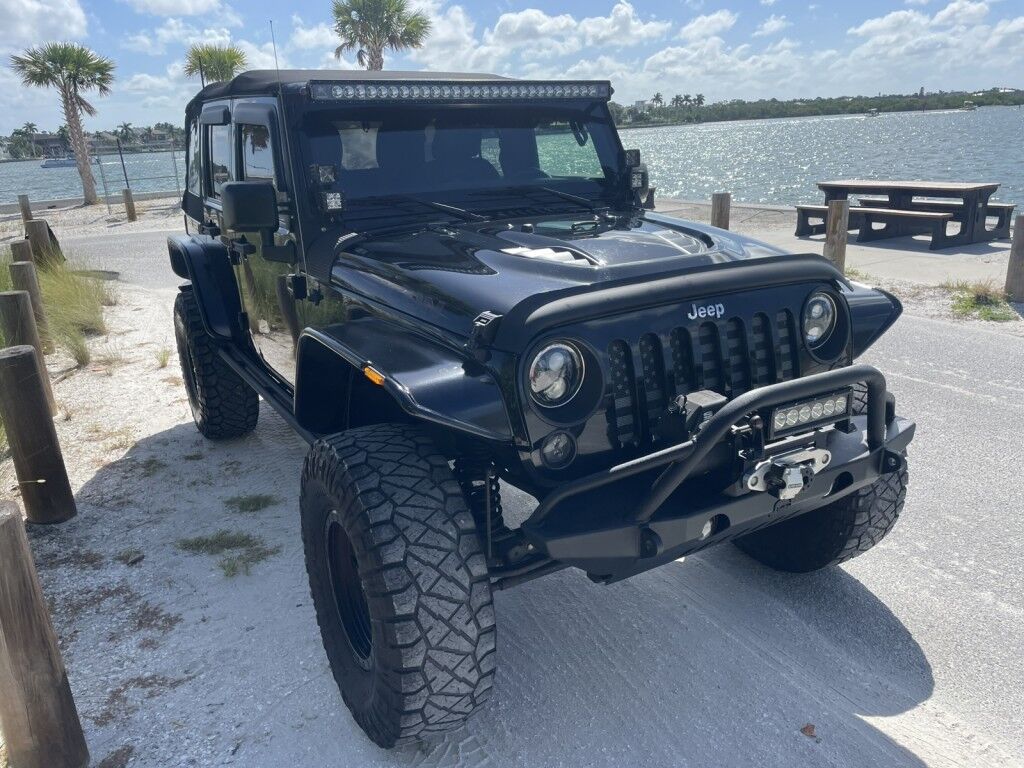 2016 Jeep Wrangler Unlimited Rubicon~LOW MILES~WINCH~LED LIGHTS ALL OVER~4X4~ALLOY SHIFT KNOB~BLUETOOTH~CRUISE CONTROL~FULL SIZE SPARE TIRE~HEATED SEATS~PREMIUM SOUND SYSTEM~REMOTE ENGINE START~REMOVABLE ROOF~TOW HOOKS Sarasota FL