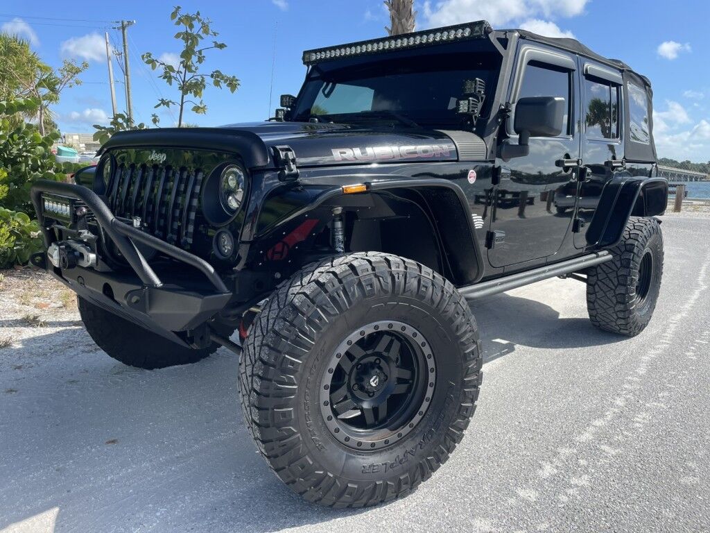 2016 Jeep Wrangler Unlimited Rubicon~LOW MILES~WINCH~LED LIGHTS ALL OVER~4X4~ALLOY SHIFT KNOB~BLUETOOTH~CRUISE CONTROL~FULL SIZE SPARE TIRE~HEATED SEATS~PREMIUM SOUND SYSTEM~REMOTE ENGINE START~REMOVABLE ROOF~TOW HOOKS Sarasota FL