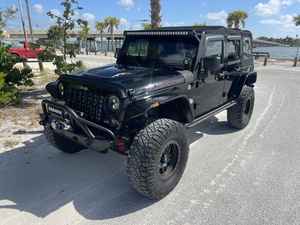 2016 Jeep Wrangler Unlimited Rubicon~LOW MILES~WINCH~LED LIGHTS ALL OVER~4X4~ALLOY SHIFT KNOB~BLUETOOTH~CRUISE CONTROL~FULL SIZE SPARE TIRE~HEATED SEATS~PREMIUM SOUND SYSTEM~REMOTE ENGINE START~REMOVABLE ROOF~TOW HOOKS Sarasota FL