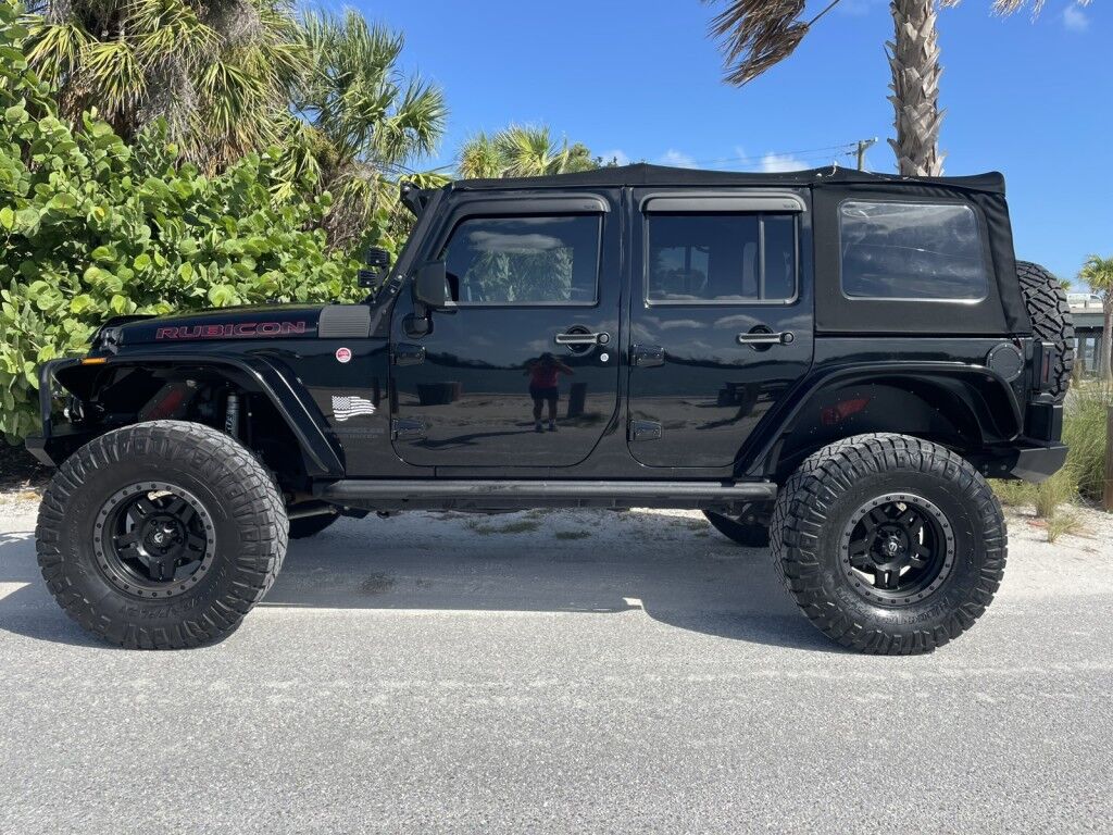 2016 Jeep Wrangler Unlimited Rubicon~LOW MILES~WINCH~LED LIGHTS ALL OVER~4X4~ALLOY SHIFT KNOB~BLUETOOTH~CRUISE CONTROL~FULL SIZE SPARE TIRE~HEATED SEATS~PREMIUM SOUND SYSTEM~REMOTE ENGINE START~REMOVABLE ROOF~TOW HOOKS Sarasota FL