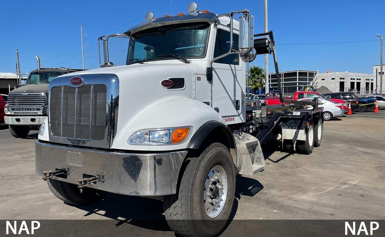 2016 Peterbilt 348 60,000 lb American Roll Off Truck