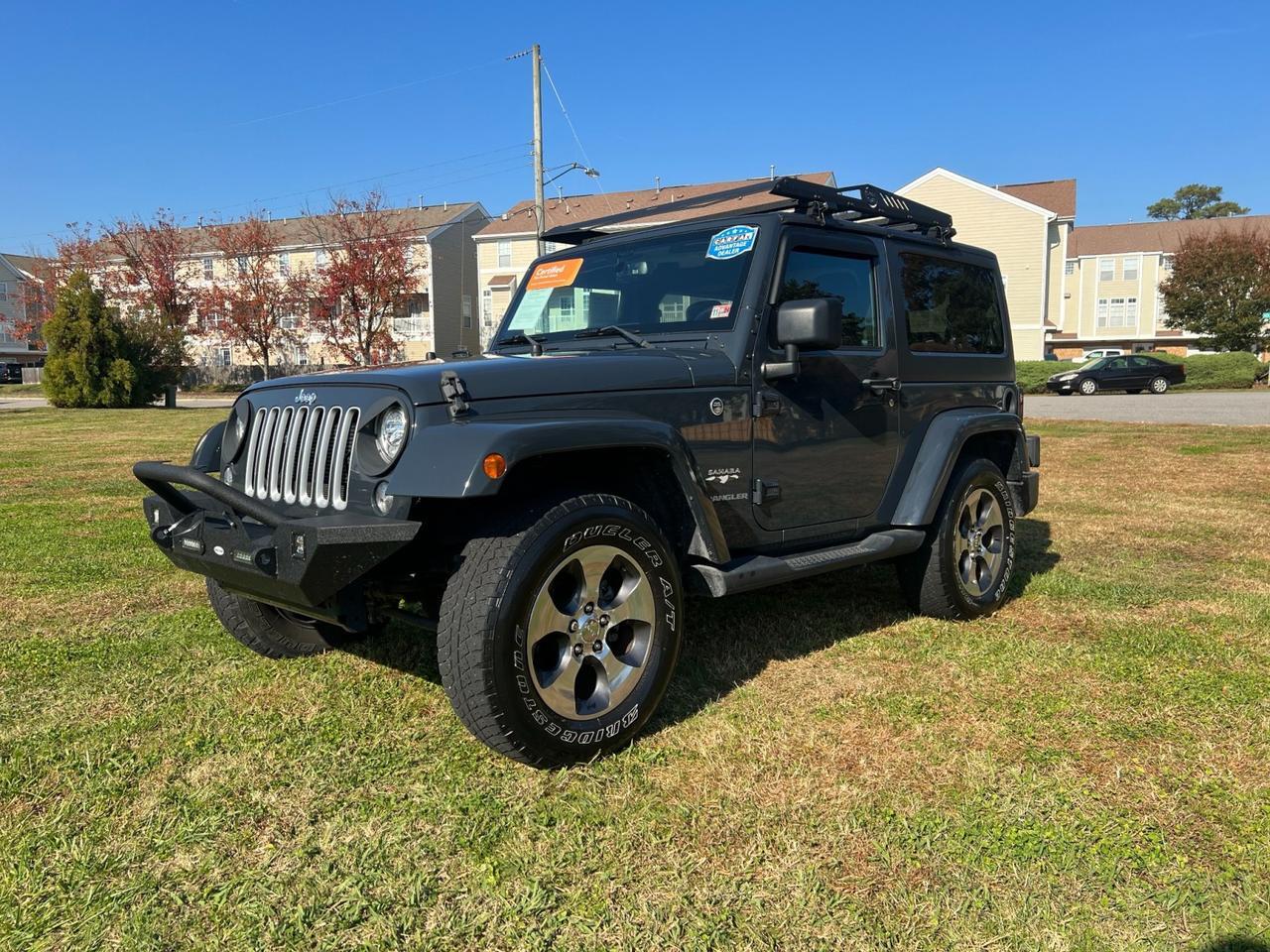 2017 Jeep Wrangler Sahara 4WD, EQUIPPED WITH DEEP TINTED GLASS, AFTERMARKET FRONT BUMPER, AND