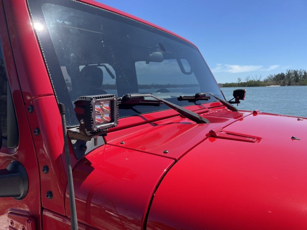 2017 Jeep Wrangler Unlimited WILLYS WHEELER~CLEAN CARFAX~WINCH~LIGHTBAR~AUXILIARY LIGHTS~LIFTED~ONLINE FINANCE AND SHIPPING AVAILABLE!!!!! Sarasota FL