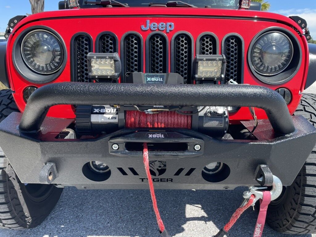 2017 Jeep Wrangler Unlimited WILLYS WHEELER~CLEAN CARFAX~WINCH~LIGHTBAR~AUXILIARY LIGHTS~LIFTED~ONLINE FINANCE AND SHIPPING AVAILABLE!!!!! Sarasota FL