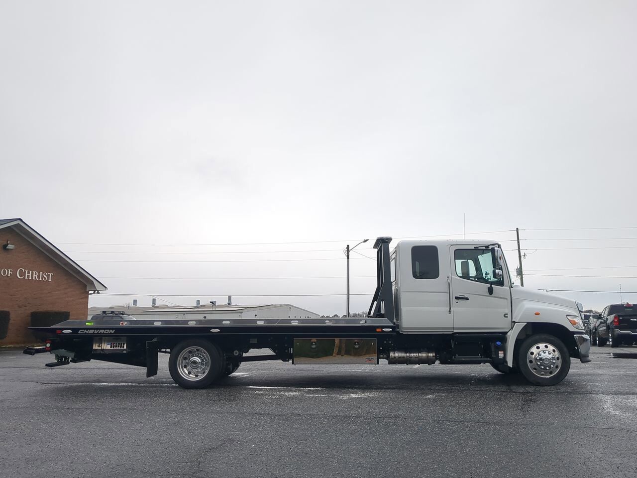 2025 Hino L6 Extended Cab equipped with Chevron 21.5ft LCG Rollback Body Winder GA