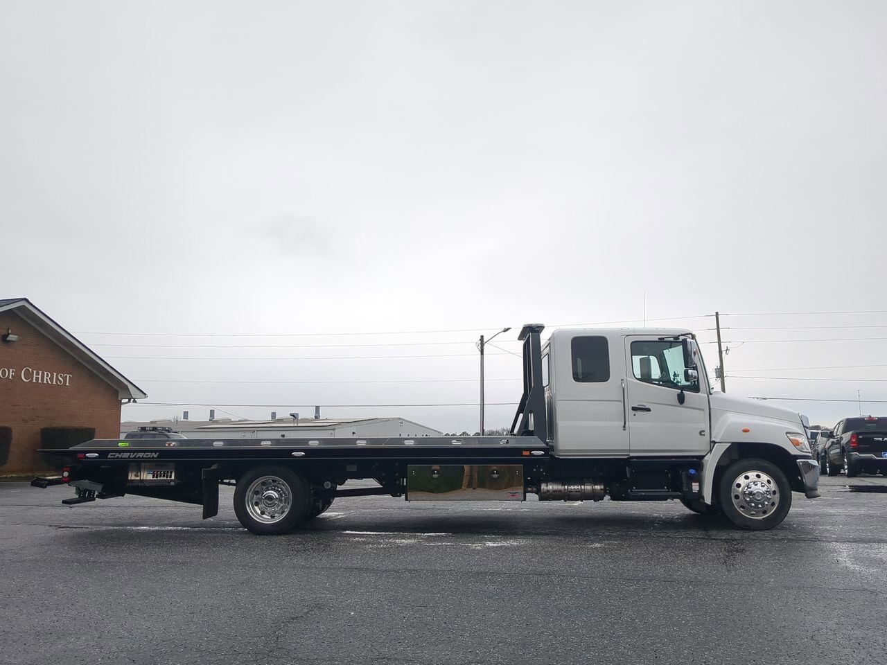 2025 Hino L6 Extended Cab equipped with Chevron 21.5ft LCG Rollback Body Winder GA