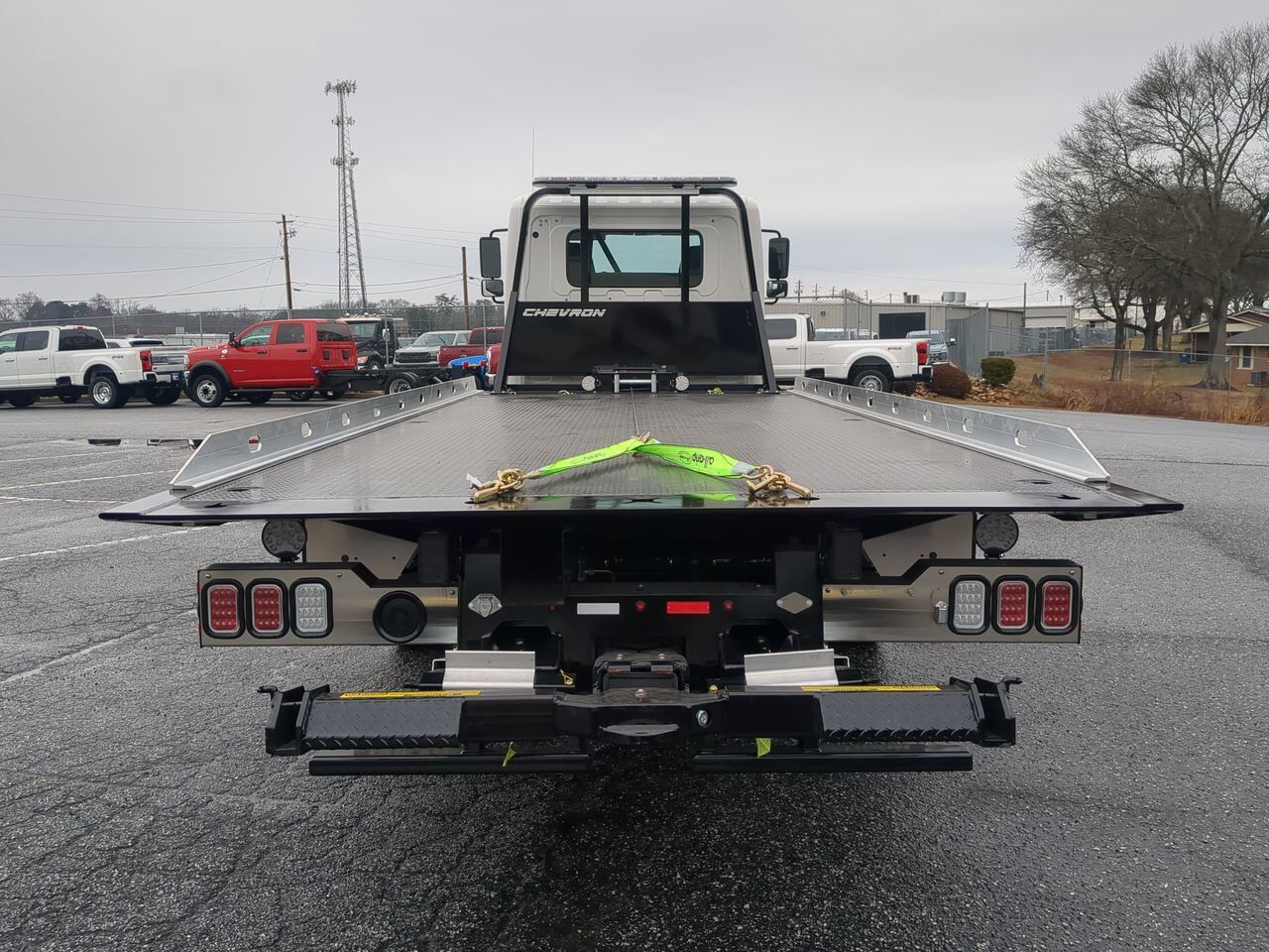 2025 Hino L6 Extended Cab equipped with Chevron 21.5ft LCG Rollback Body Winder GA