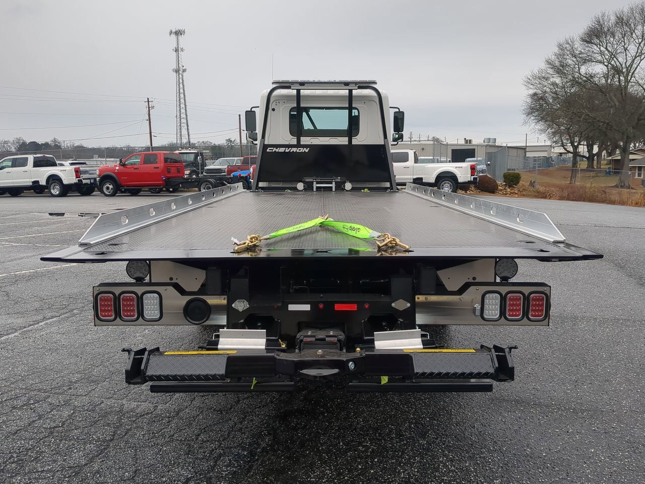 2025 Hino L6 Extended Cab equipped with Chevron 21.5ft LCG Rollback Body Winder GA