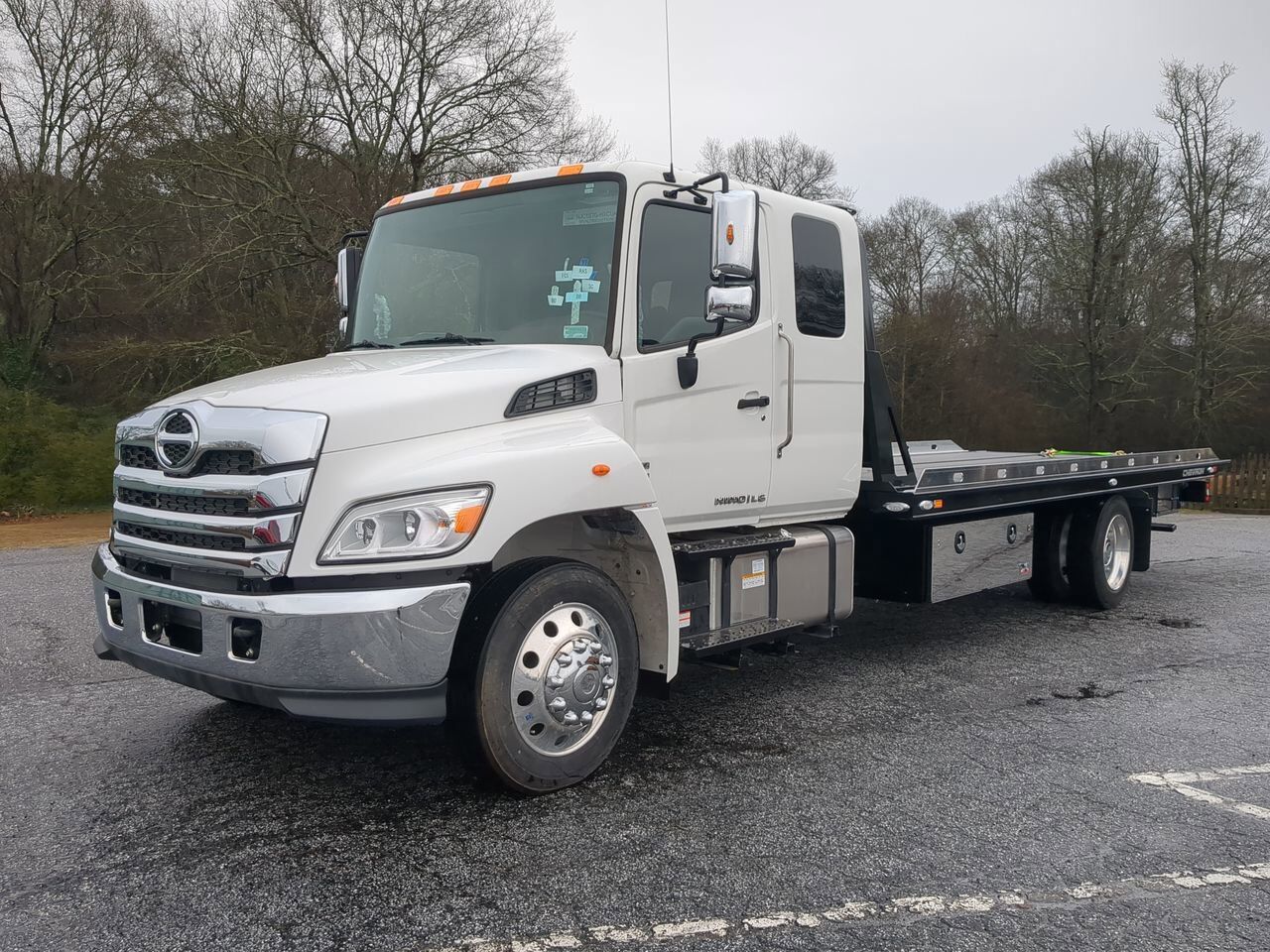2025 Hino L6 Extended Cab equipped with Chevron 21.5ft LCG Rollback Body Winder GA