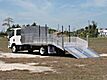 2025 Isuzu NPR-XD Crew Cab 14+4 Aluminum Dovetail Flatbed
