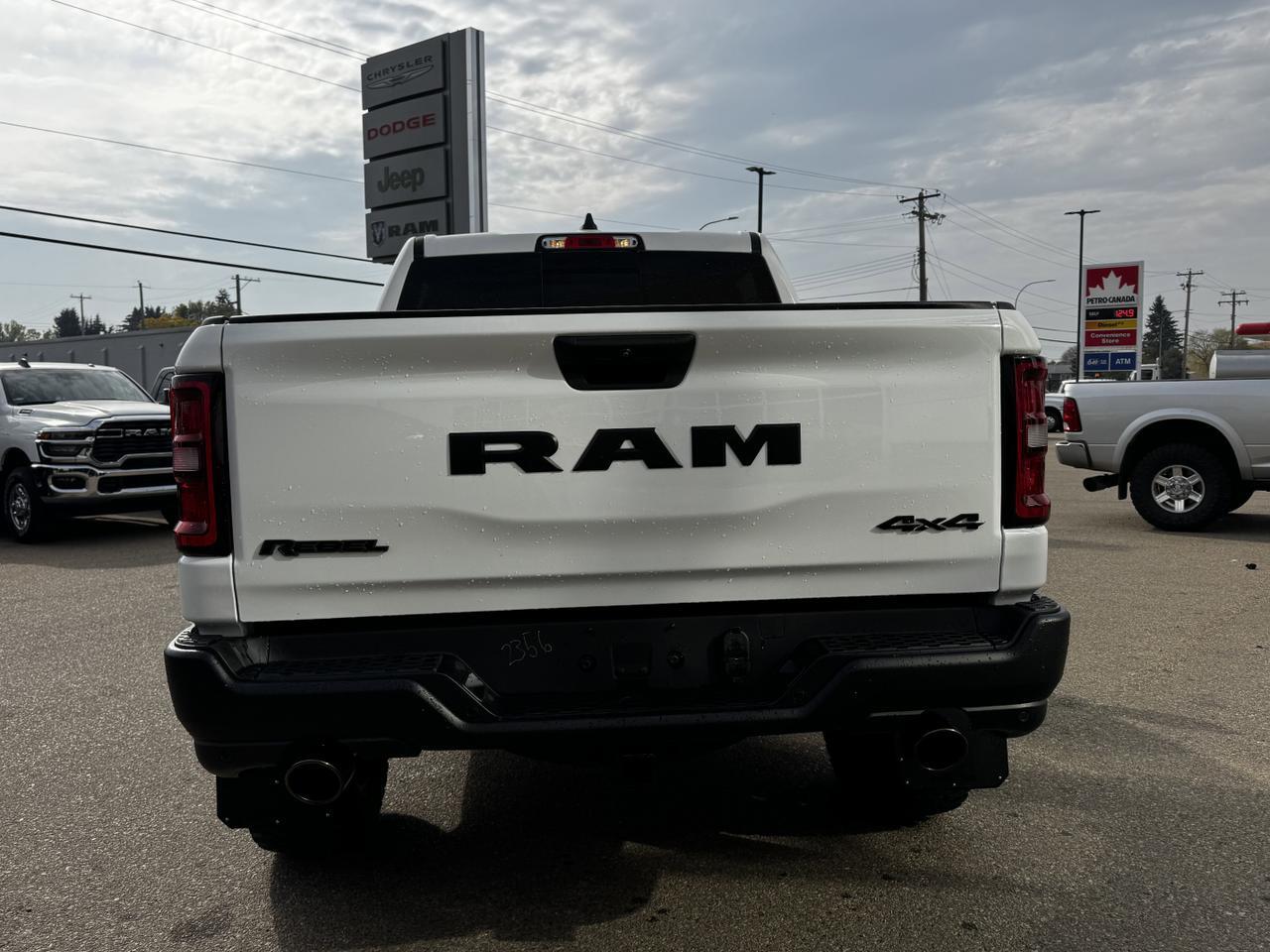 2025 Ram 1500 Rebel Crew Cab 4x4 | MILK MAN |  Rig Ready Ram | 3L Hurricane | Cloth Vinyl | Red Inserts Redwater AB