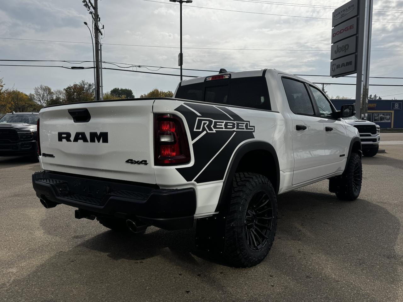 2025 Ram 1500 Rebel Crew Cab 4x4 | MILK MAN |  Rig Ready Ram | 3L Hurricane | Cloth Vinyl | Red Inserts Redwater AB
