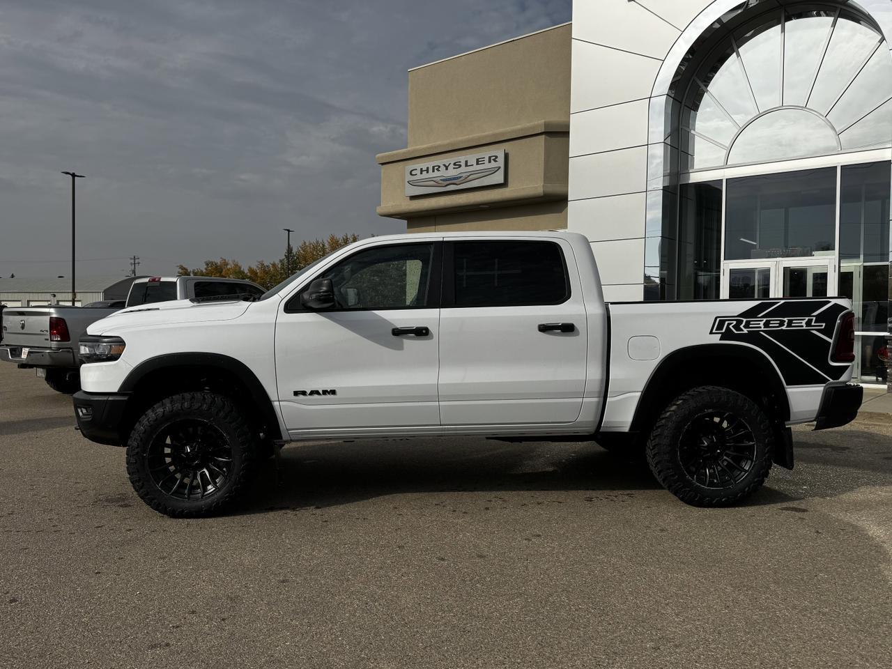 2025 Ram 1500 Rebel Crew Cab 4x4 | MILK MAN |  Rig Ready Ram | 3L Hurricane | Cloth Vinyl | Red Inserts Redwater AB