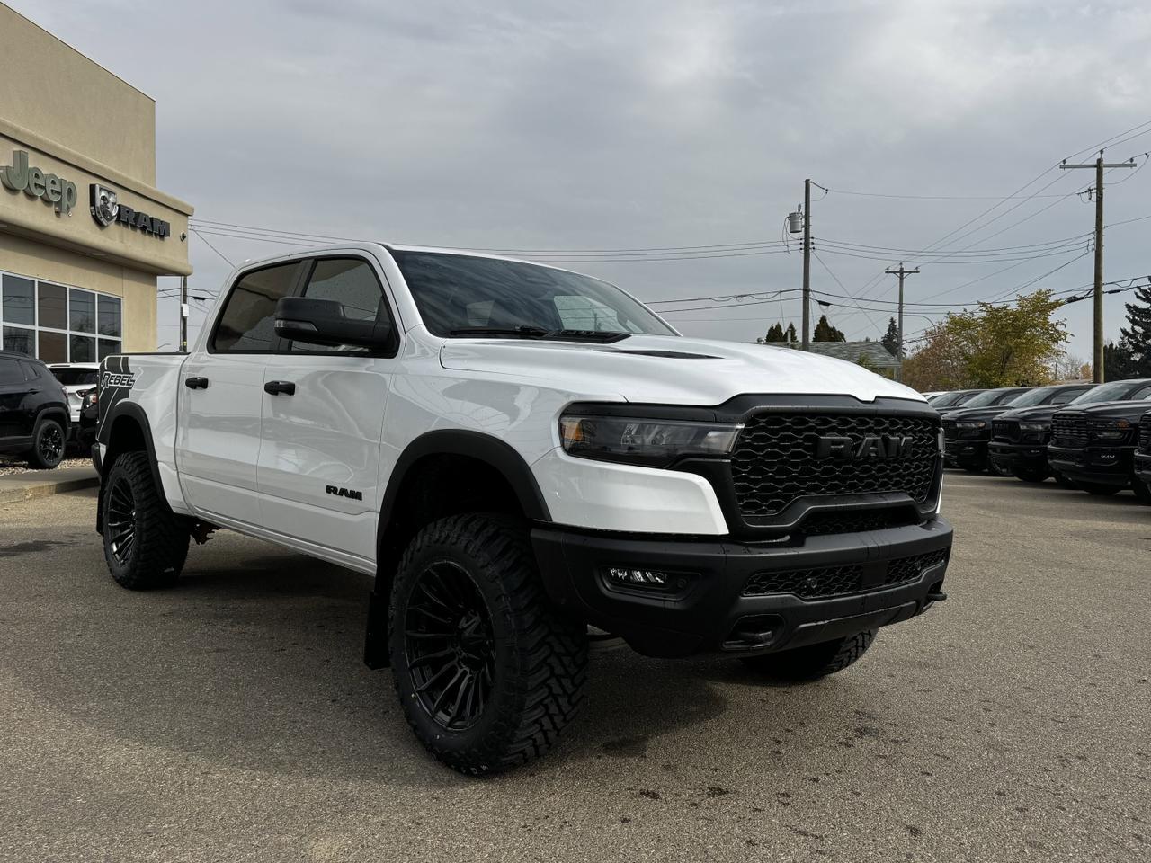 2025 Ram 1500 Rebel Crew Cab 4x4 | MILK MAN |  Rig Ready Ram | 3L Hurricane | Cloth Vinyl | Red Inserts Redwater AB