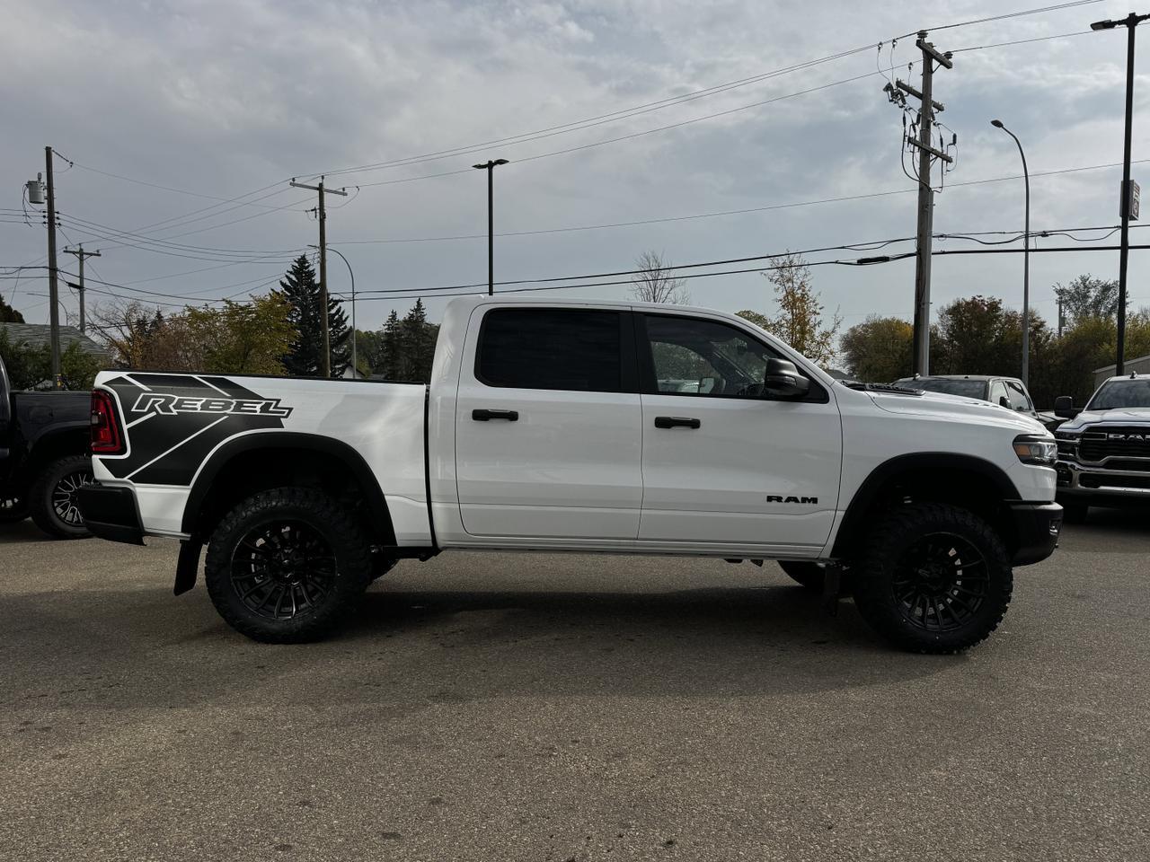 2025 Ram 1500 Rebel Crew Cab 4x4 | MILK MAN |  Rig Ready Ram | 3L Hurricane | Cloth Vinyl | Red Inserts Redwater AB