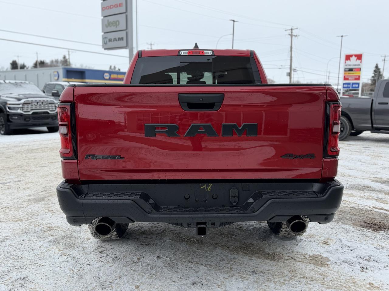 2026 Ram 1500 Rebel Crew Cab 4x4 | Molten Red | 3L Hurricane | Sport Hood | NAV | Alpine Audio | Remote Start Redwater AB