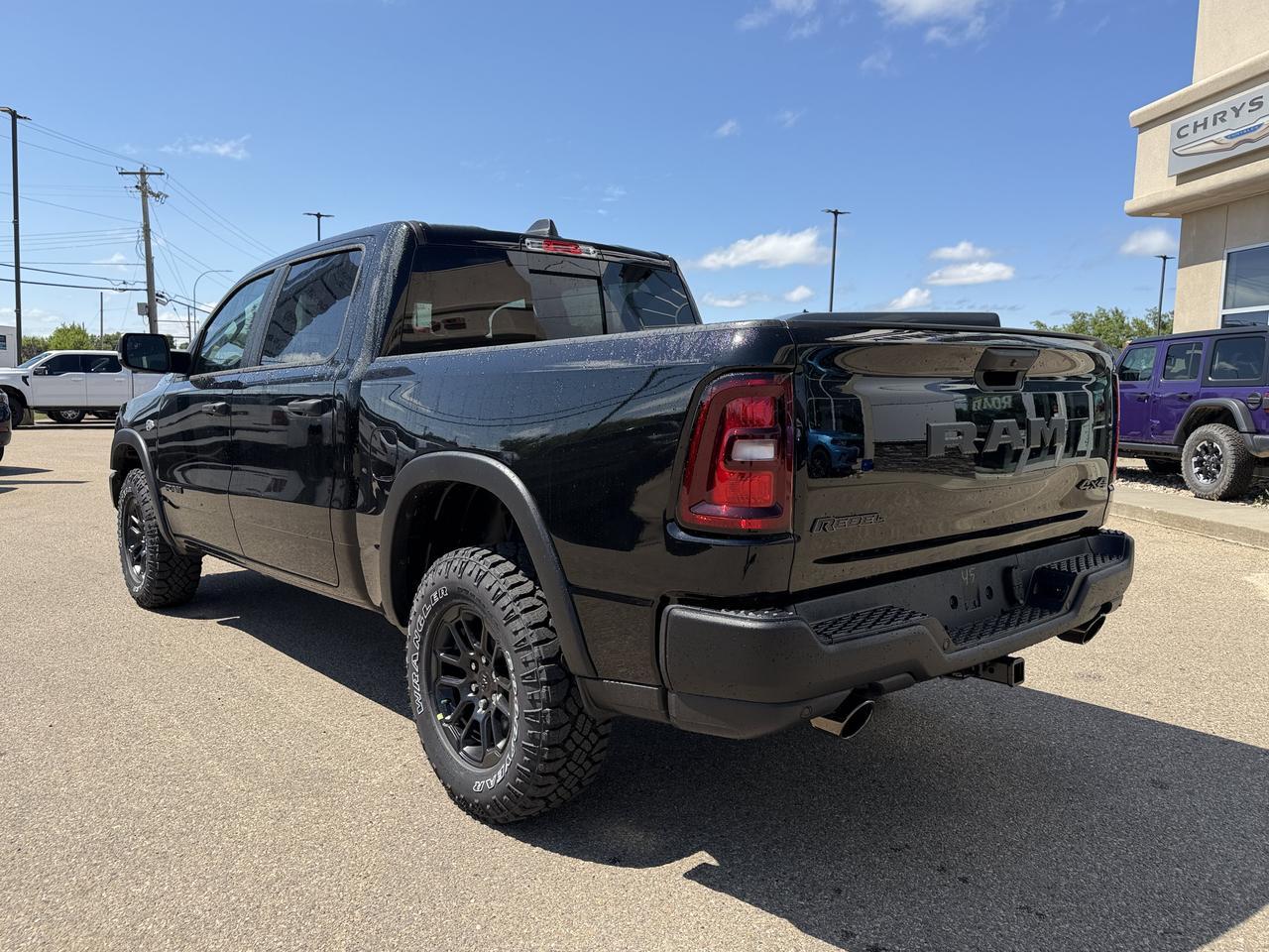 2026 Ram 1500 Rebel Crew Cab 4x4 | V8 Hybrid | 12IN Display | NAV | Backup Camera | Off-Road Suspension Redwater AB