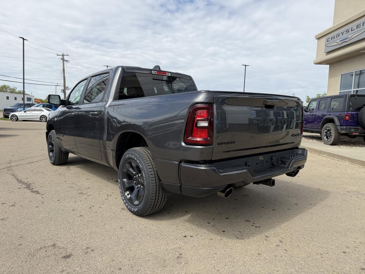 2026 Ram 1500 Sport Crew Cab 4x4 | HEMI V8 | Pano Sunroof | 12IN Display | NAV | Heated Seats | Granite Crystal Redwater AB