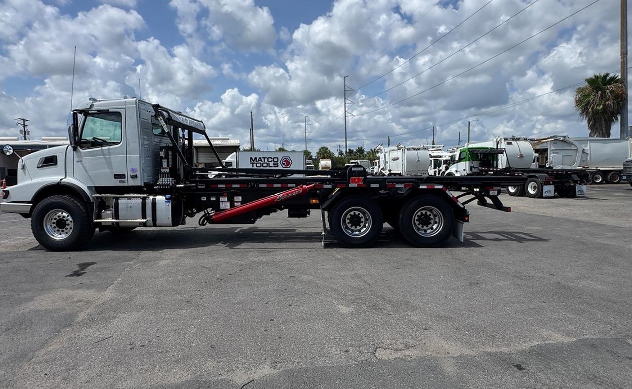 2027 Volvo VHD64B300 60,000 lb. PacMac Roll-off Truck